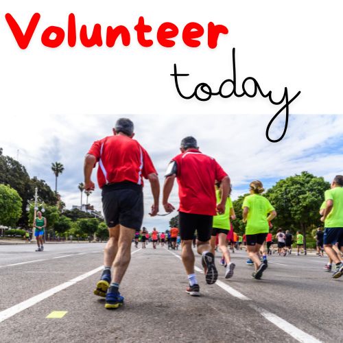 A picture of a group of people jogging in a race. Above them it says volunteer today.